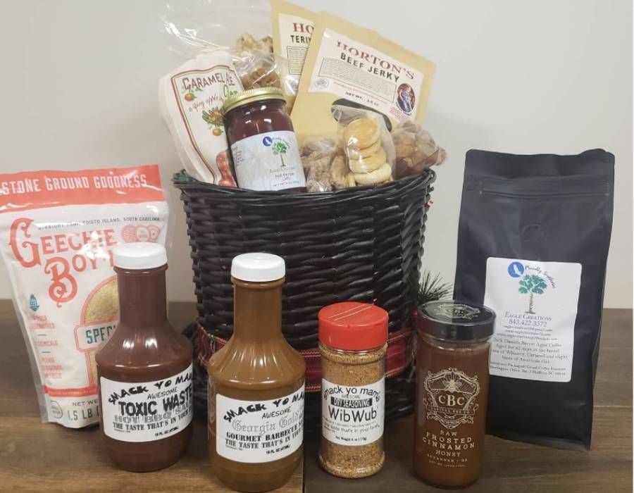 Southern-style gourmet gift basket from Eagle Creations in Bluffton, SC, filled with local favorites like Geechie Boy grits, snack sauces, beef jerky, cookies, seasoning, roasted cinnamon honey, and artisan coffee.